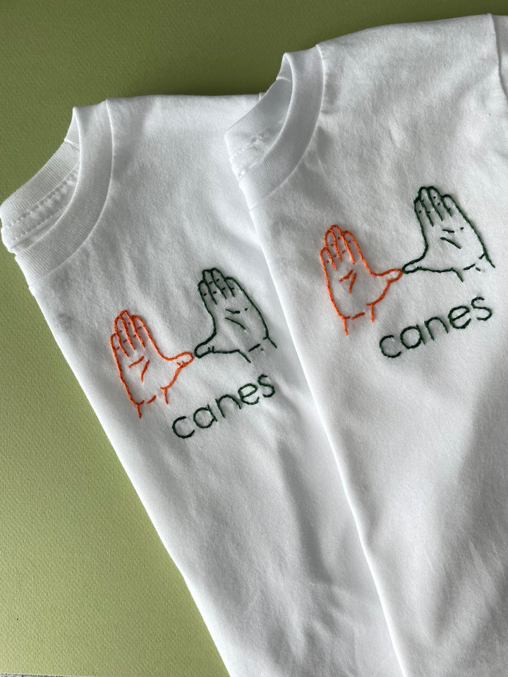 The "U" hand sign shirt.  University of Miami Hurricanes Hand Embroidered